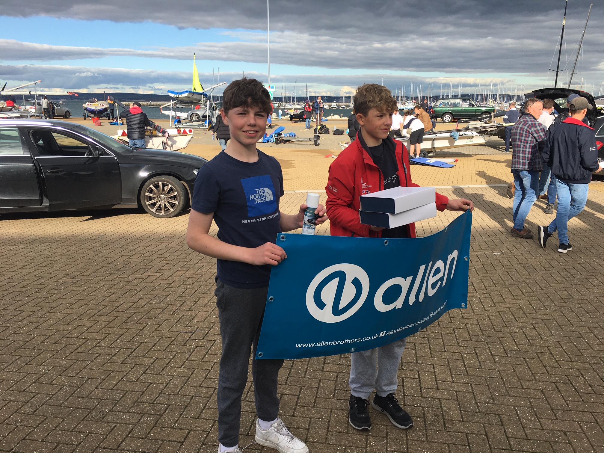 Nick Evans holding an allen banner