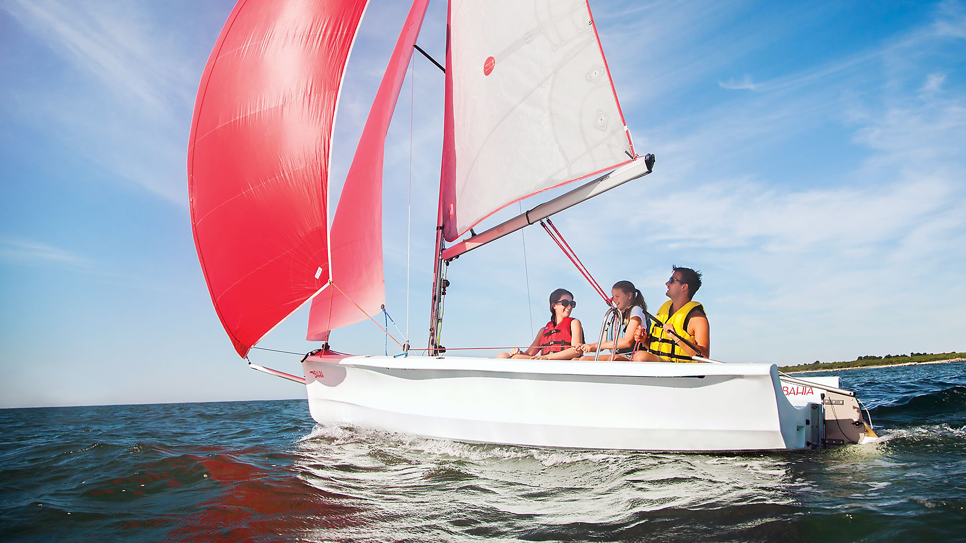 Laser Bahia sailing with a young family